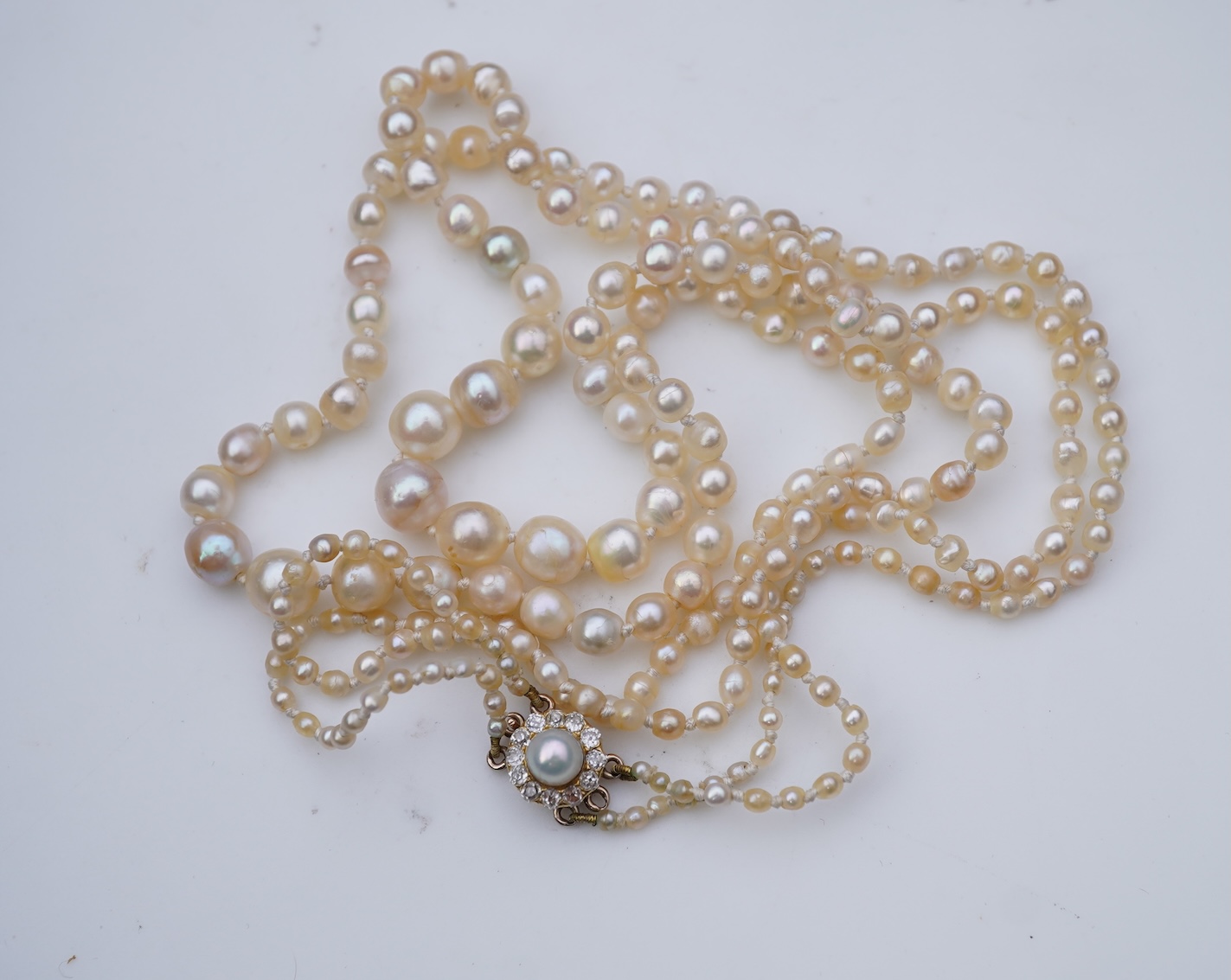 A natural pearl and diamond necklace, early 20th century